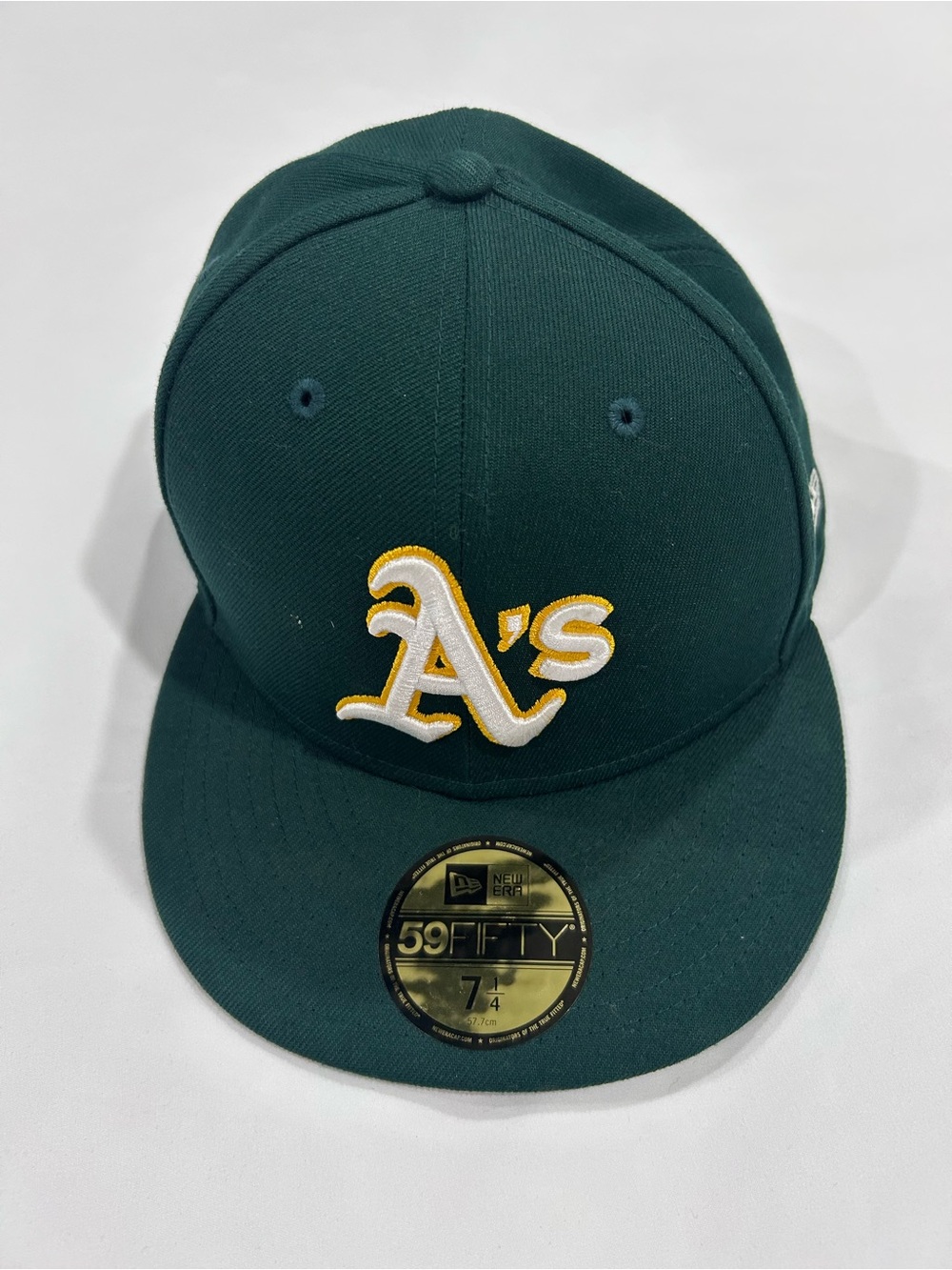 New Era Dark Green Oakland A's Fitted Cap with Yellow-White Logo. Size 7 1/4.